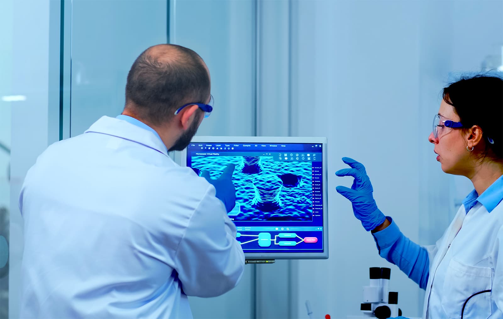 Technicians reviewing hearing test results in a laboratory
